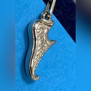 Sterling silver Aladdin slipper charm.